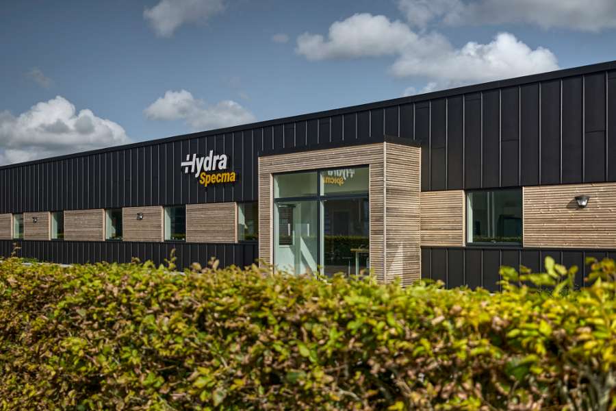 Black steel profiles and warm wood create striking contrasts on headquarters facade, Jernvej 19, 6900 Skjern, Denmark